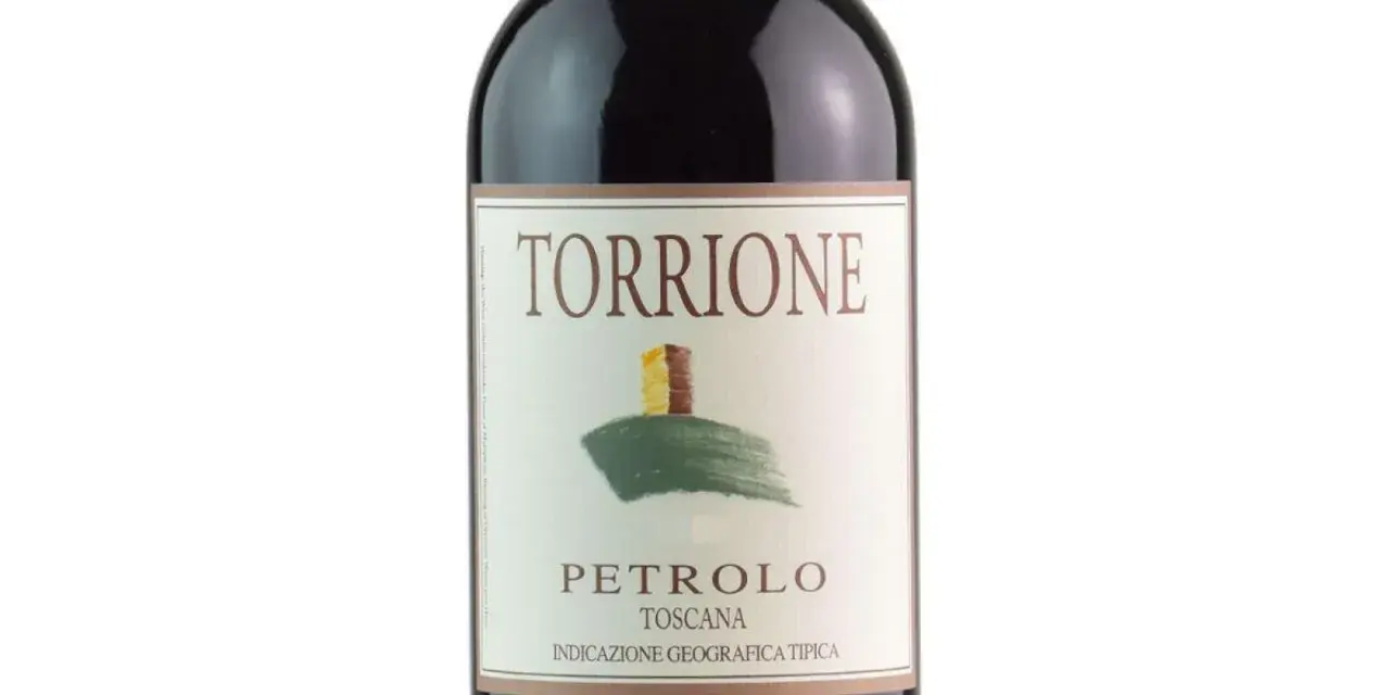 Bottle of Torcione Petrolo wine from Toscana, with a label featuring a drawing of a tower on a hill.