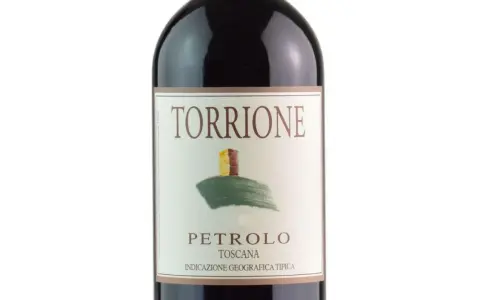 Bottle of Torcione Petrolo wine from Toscana, with a label featuring a drawing of a tower on a hill.